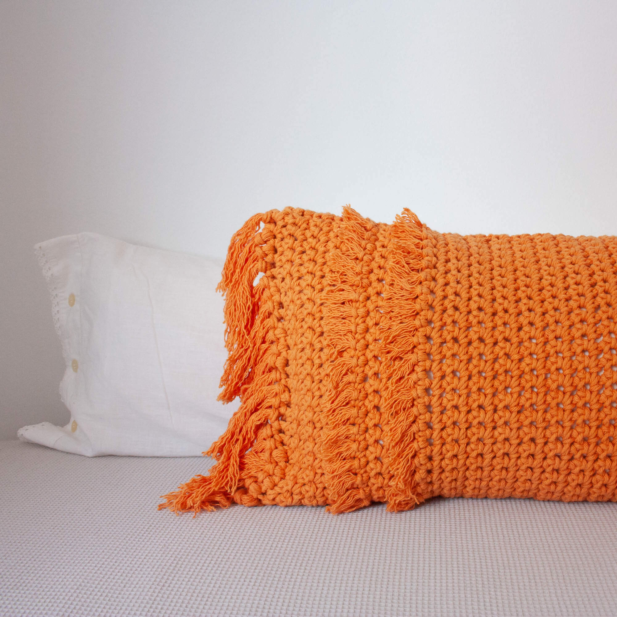 Crochet Pillow “Textures from the Loom” – Orange Fringes