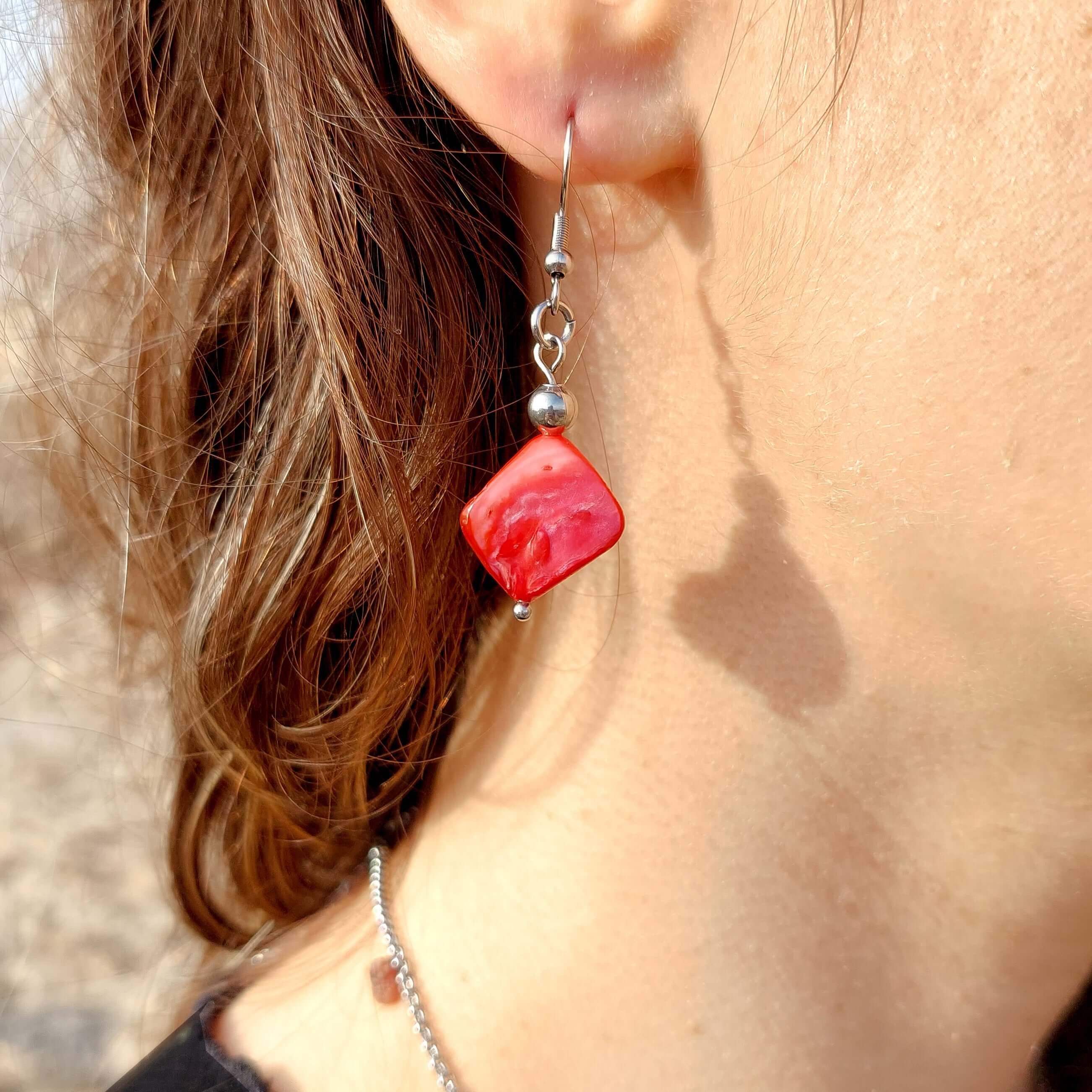 Handmade red mother of pearl dangle drop earrings with stainless steel and hypoallergenic hooks.