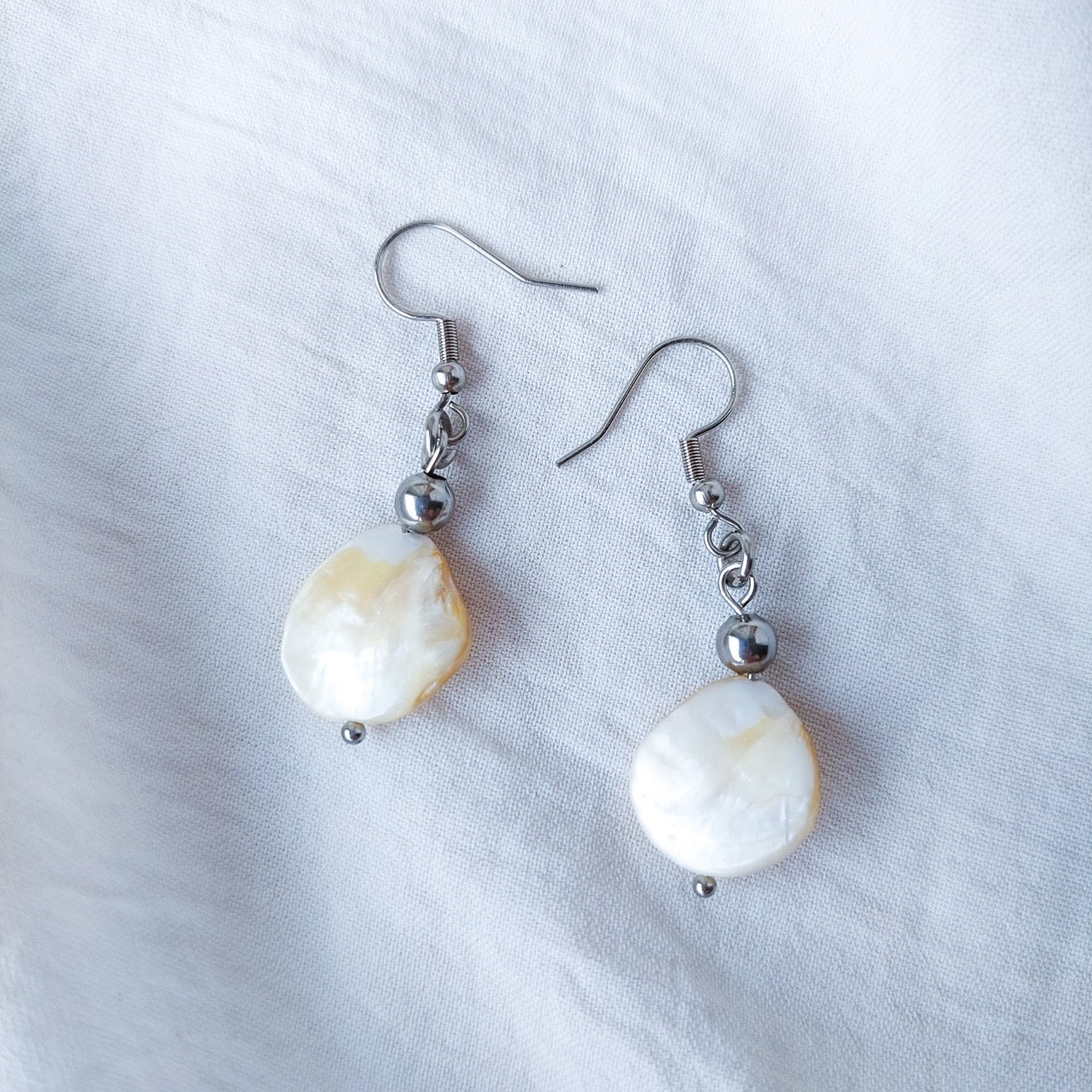 Handmade mother of pearl dangle drop earrings with stainless steel and hypoallergenic hooks.