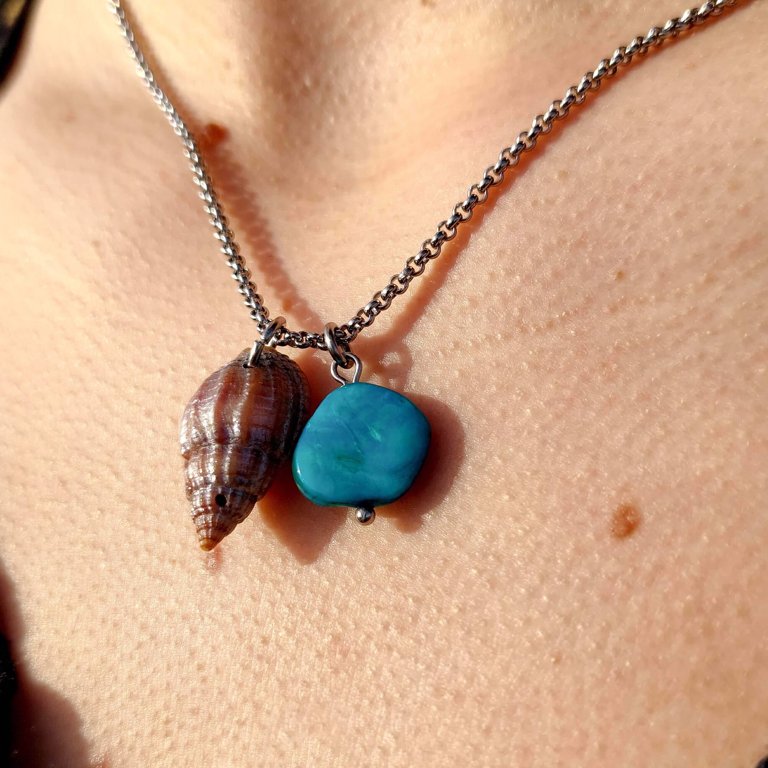 Handmade blue mother of pearl and conch pendant, with a stainless steel necklace.