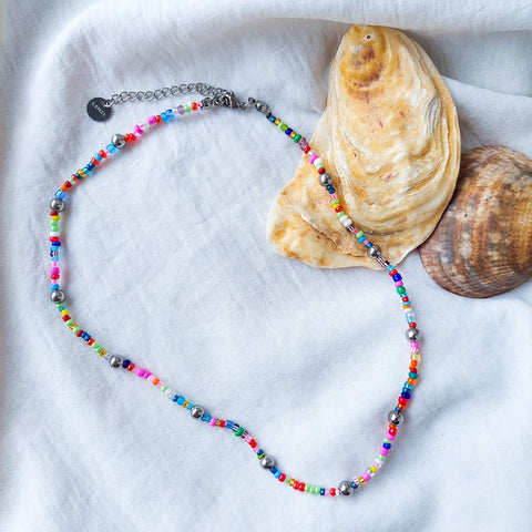 Handmade natural river pearl beaded necklace. The delight of all seaside lovers!  With acrylic beads, nylon thread and stainless steal hook. 